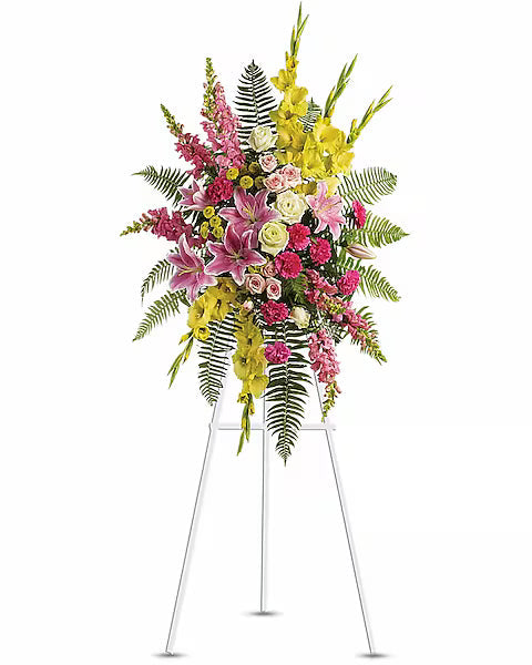 Bright floral centerpiece on white stand