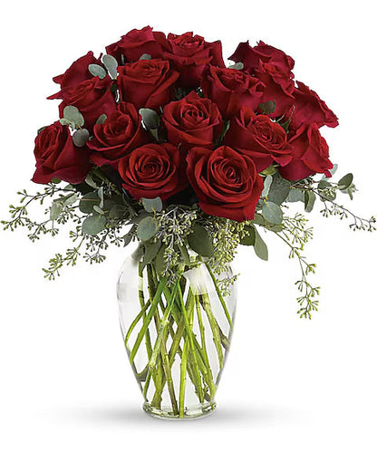 Romantic red roses in vase – floral arrangement